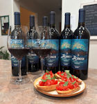 Bottles of Sangiovese with a plate of bruschetta